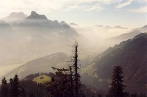 View of the Rgmt vallee, misty mountain range