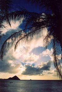 Sunrays behind cloud over ocean, Santa Lucia
